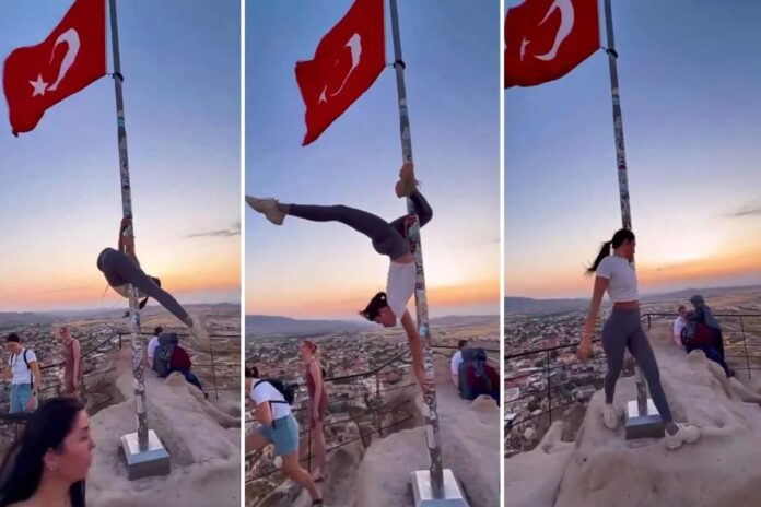 Turista enfrenta cárcel por pole dance en hasta de bandera turca en Capadocia