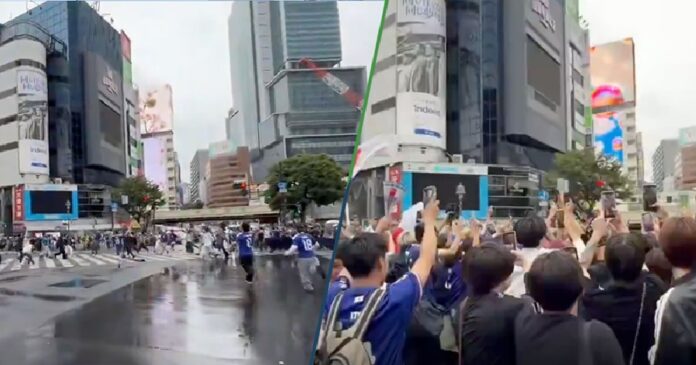 Aficionados japoneses celebrando en el cruce peatonal de Shibuya, Tokio, solo cuando el semáforo está en rojo tras el partido del Mundial 2026.