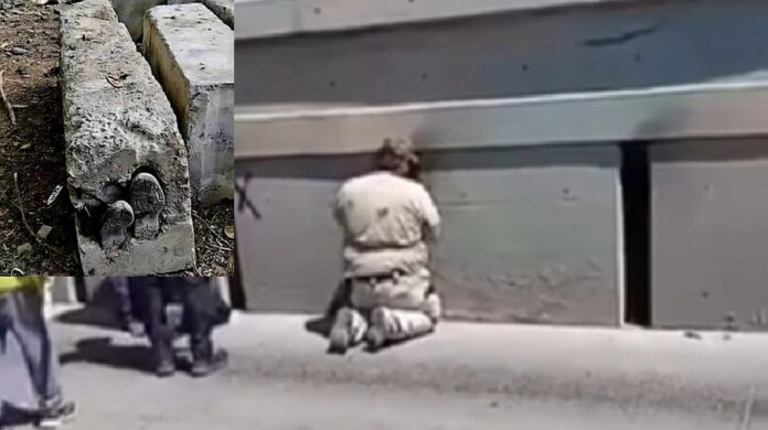 Personal forense y autoridades trabajan en la recuperación del cuerpo de una mujer localizado dentro de una estructura de concreto bajo un viaducto en Tijuana.