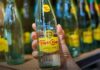 Topo Chico, empresa de Coca-Cola, paga 2 mil 593 millones y evita proceso penal con la FGR Botellas de Topo Chico, marca propiedad de The Coca-Cola Company, involucrada en un acuerdo reparatorio con autoridades fiscales mexicanas.